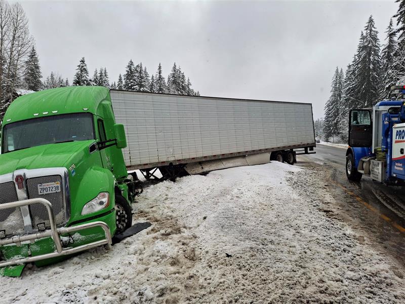 Snow day semi-truck recovery